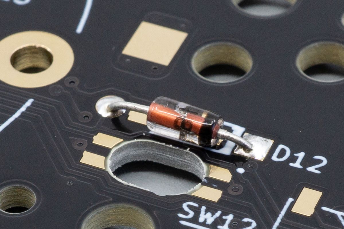 For through-hole diodes, the thick black line on the diode should face toward the thick white line on the PCB