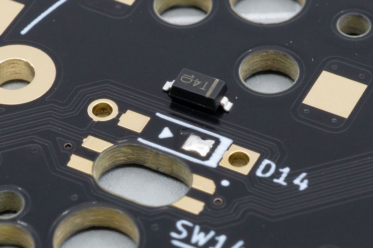 Applying some tin to one pad ahead of time makes it much easier to align the diode with the pad