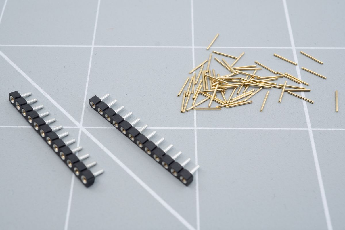 Socket strips and mill-max pins. You can also get fancy header pins, which basically put all the pins on a single strip for easy assembly