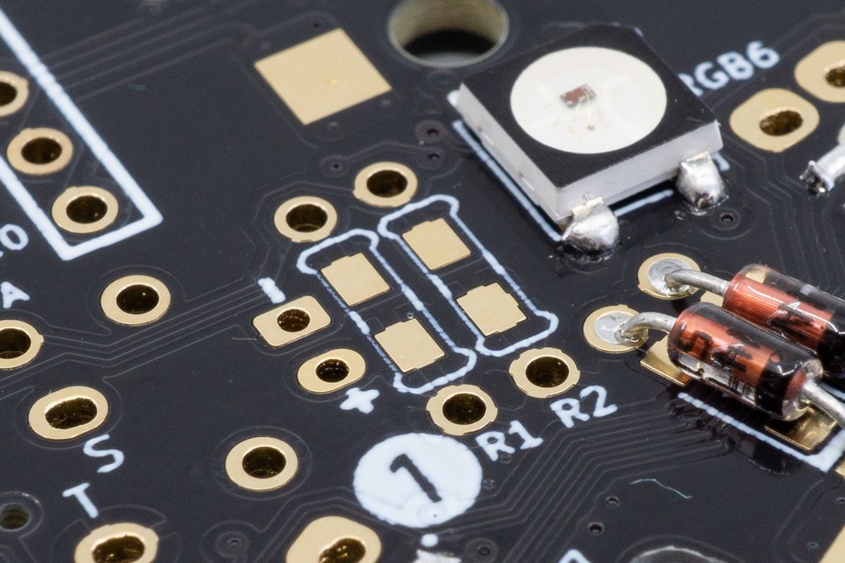 The resistor footprints on the PCB, marked R1 and R2 here