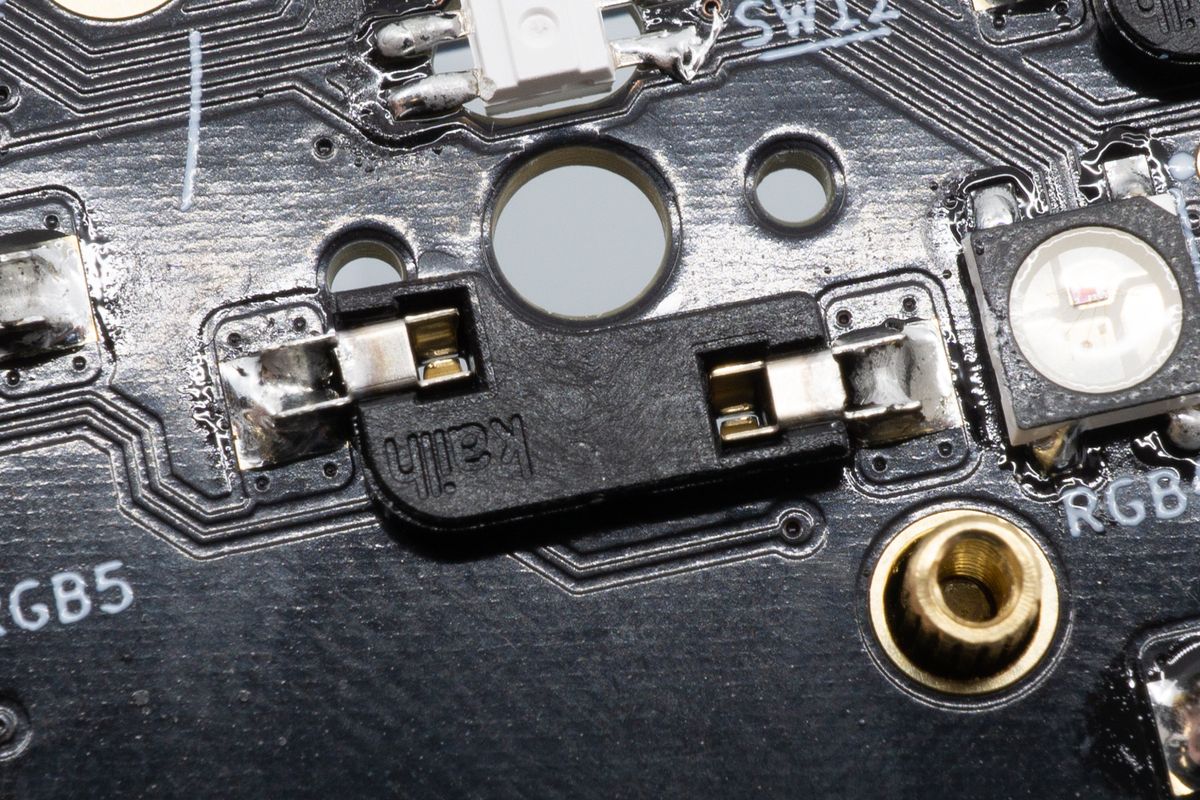 The orientation does matter - make sure the flat side is facing toward you, and make sure the socket doesn't overlap with the big hole in the center. The socket in this picture is already soldered, you'll go do that too in the next few steps