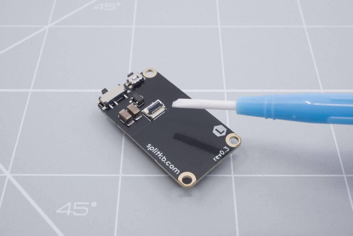 Lifting up the battery connector tab
