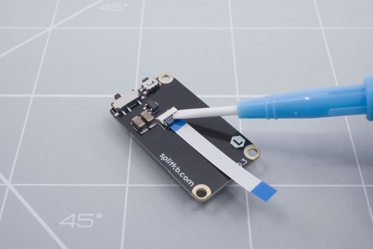 Lowering down the battery connector tab