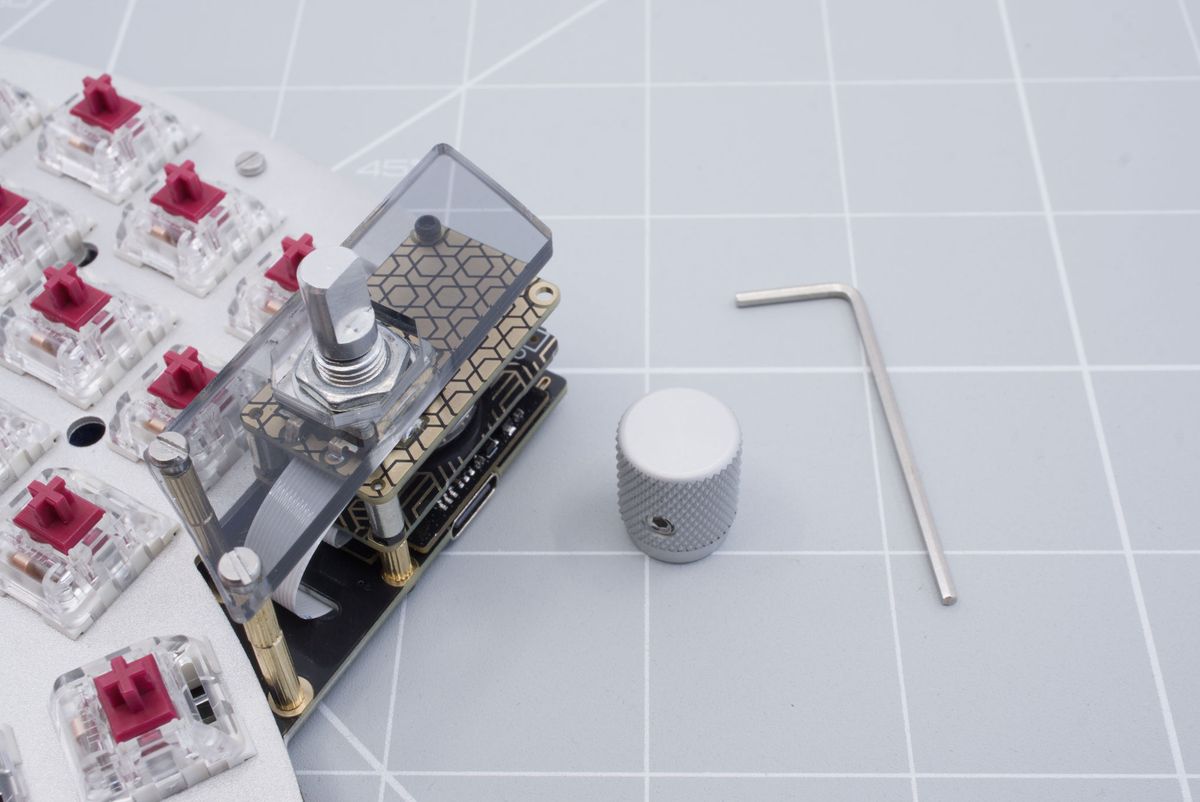 The keyboard, an encoder knob and the included Allen key from your encoder