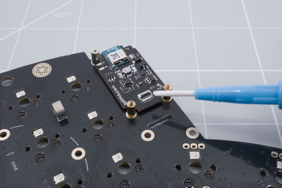 Lifting up the battery connector tab