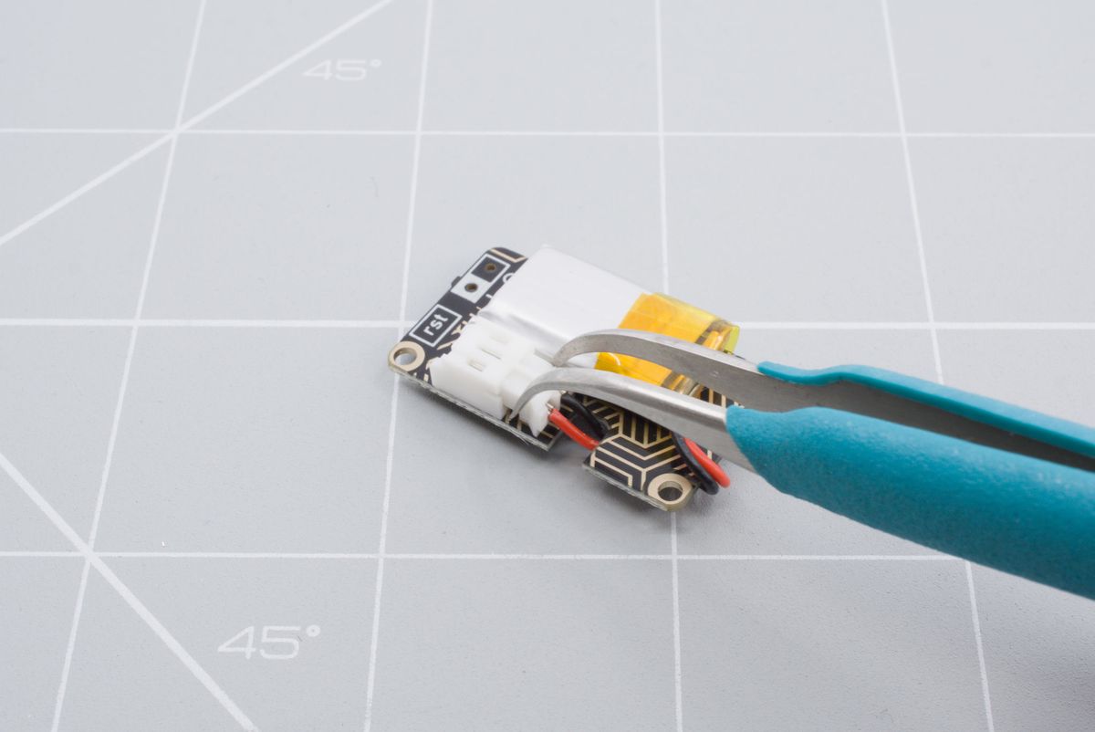Unplugging the JST connector is easier using tweezers or pliers