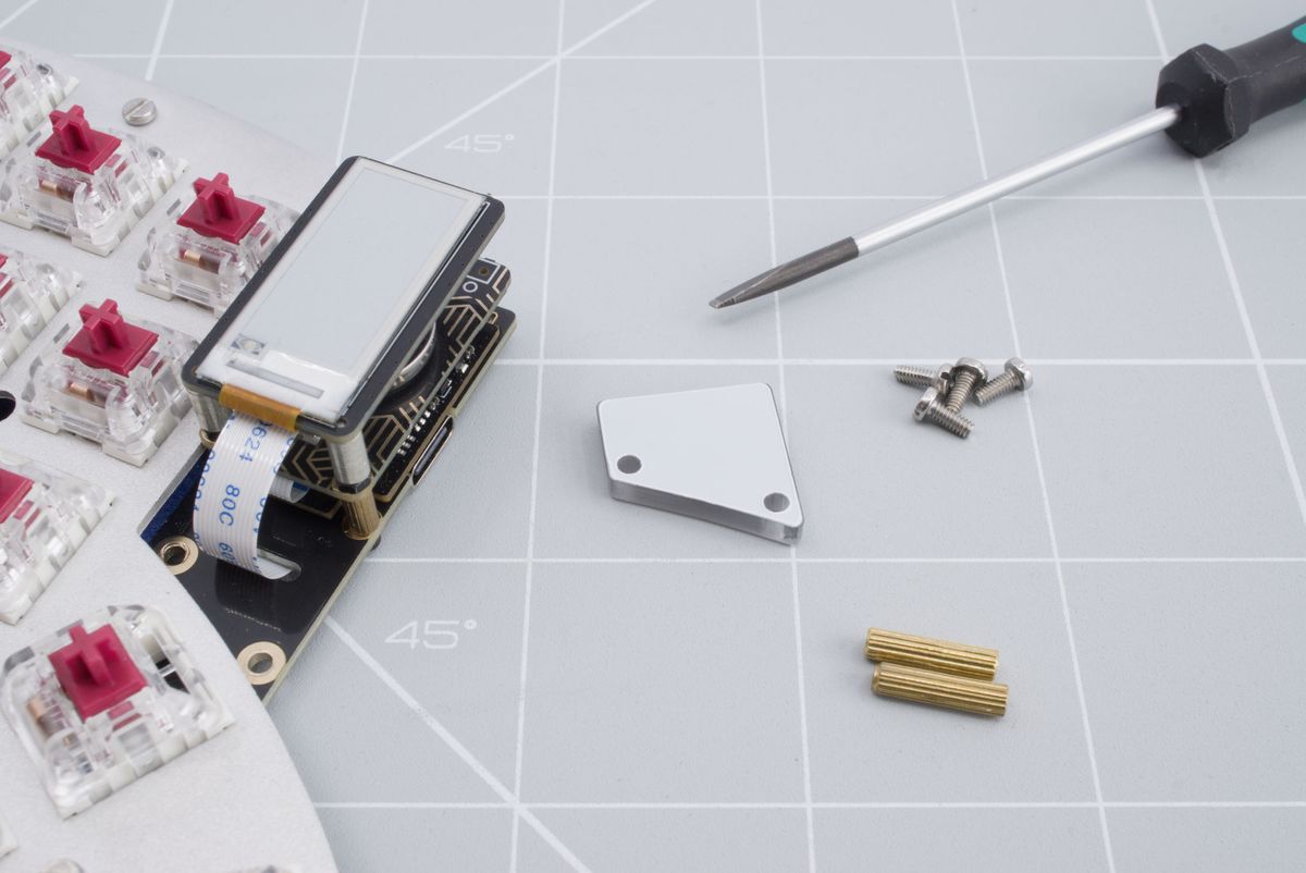 The keyboard, the cover, two 12mm spacers, four screws and a flat head screwdriver.