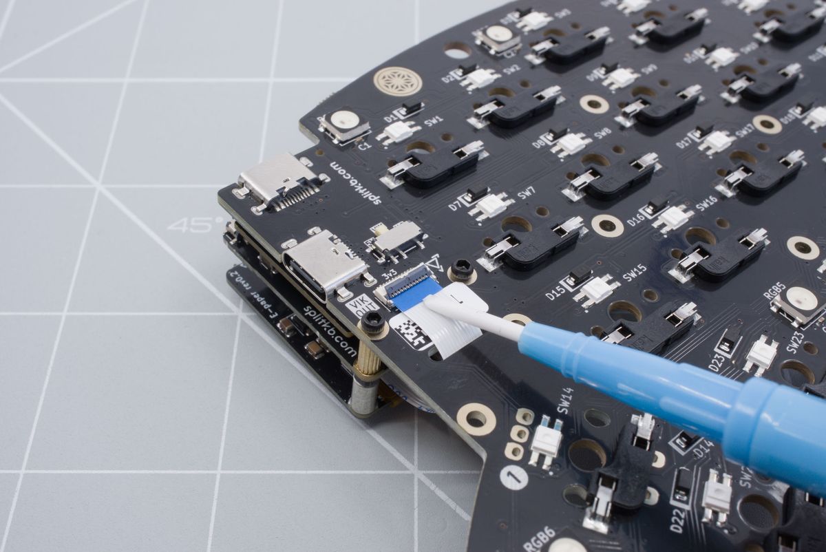 Pushing in the cable with a non-conductive tool