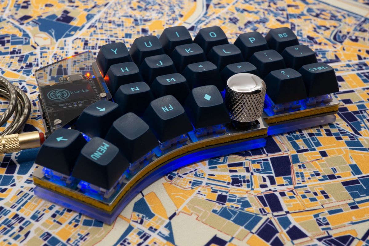 A Kyria with its underglow and per-key RGB turned on